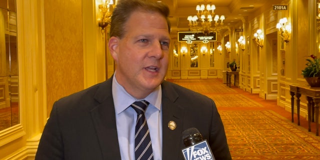 New Hampshire Gov. Chris Sununu speaks with Fox News at the Republican Jewish Coalition's annual leadership gathering, in Las Vegas, Nevada on Nov. 9, 2021
