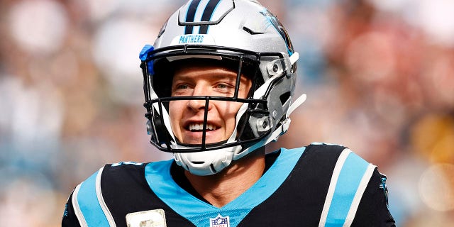 Christian McCaffrey of the Carolina Panthers looks on during the first half of a game against the Washington Football Team at Bank of America Stadium on Nov. 21, 2021, in Charlotte, N.C.