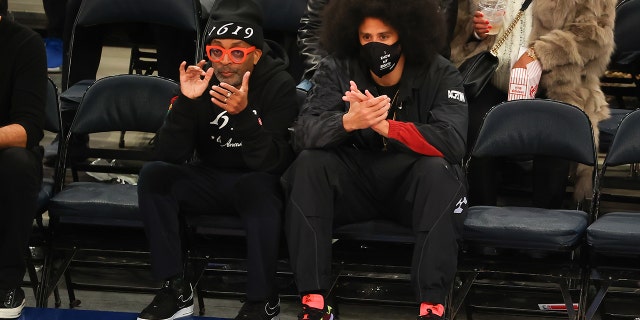 Director Spike Lee and Colin Kapernick sit courtside on February 2, 2022, at Madison Square Garden in New York City.