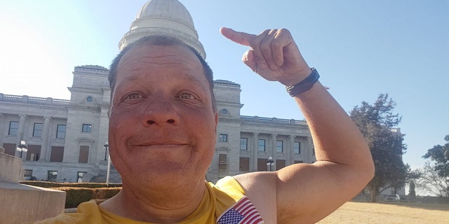Bob Barnes, in front of the Arkansas State Capitol.  He's cycling to all 50 US state capitals this year. "one capital at a time," He said. 