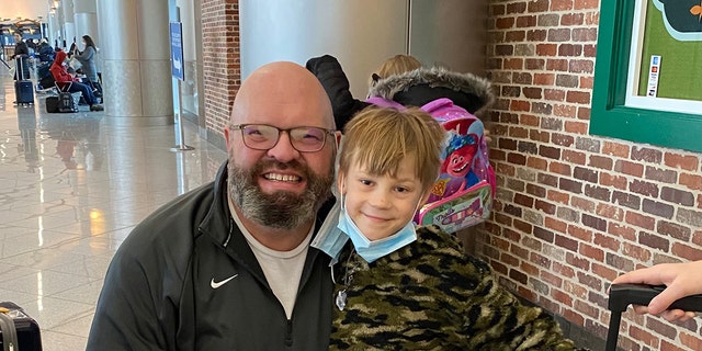 Dr. Christopher Jahraus (left) is doing everything he can to bring 9-year-old Sashko (right) to the U.S. from Ukraine after Russia invaded the country earlier this week. 