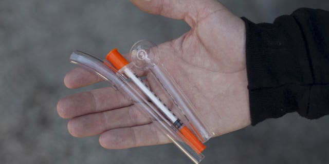 A pipe for crack cocaine use, a needle for heroin use and a pipe for methamphetamine use are shown at the People's Harm Reduction Alliance, the nation's largest needle-exchange program, in Seattle, Washington. 
