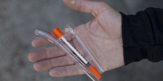 A pipe for crack cocaine use, a needle for heroin use, and a pipe for methamphetamine use are shown at the People's Harm Reduction Alliance, the nation's largest needle-exchange program, in Seattle, Washington, April 30, 2015.