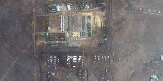 This satellite image provided by Maxar Technologies shows troops gathered at a training ground in Novoozernoye, Crimea, on Tuesday.