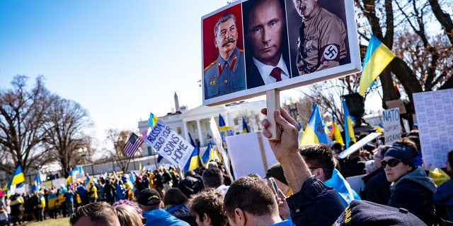People participate in a pro-Ukrainian protest in Lafayette Park near the White House on February 27, 2022, in Washington, DC.
