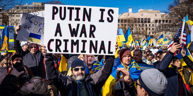 People participate in a pro-Ukrainian protest in Lafayette Park near the White House on February 27, 2022, in Washington, DC. Many U.S. cities have seen rallies in support of Ukraine over the weekend as the invasion by Russian forces continues.