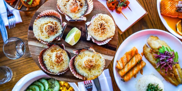 Baby Brasa, a West Village hot spot, teleports you to a tropical oasis thanks to the vibrant greenery, strong cocktails, and live Latin music in New York City.
