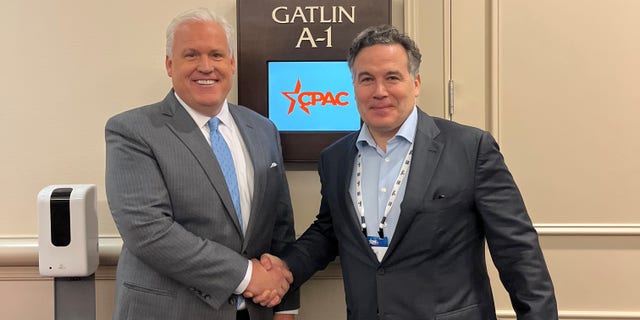 Pennsylvania GOP Senate candidate David McCormick (R) meets with American Conservative Union chair Matt Schlapp at Conservative Political Action Conference (CPAC) in Orlando, Florida, on Feb. 24, 2022.
