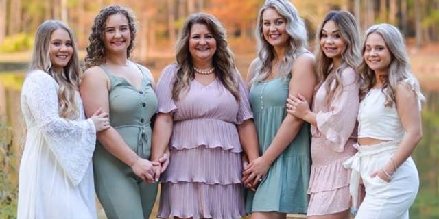 Linda Durrence (center) and her family are opening a free boutique to help children in need. Durrence is pictured with her daughters.