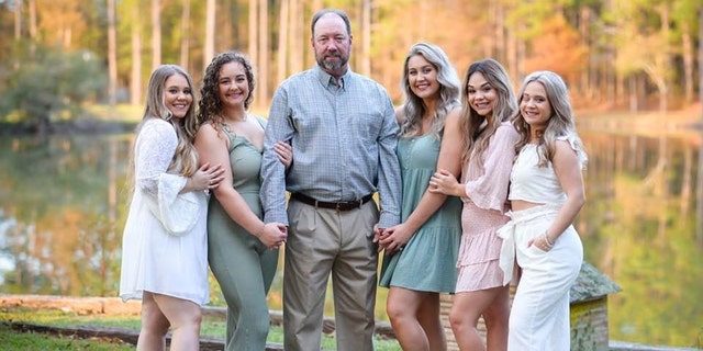 "Mark, my husband, has just been a loving example to the girls, of what a dad is supposed to be," Durrence told Fox News Digital of her husband. Mark Durrence (center) is pictured with his daughters.