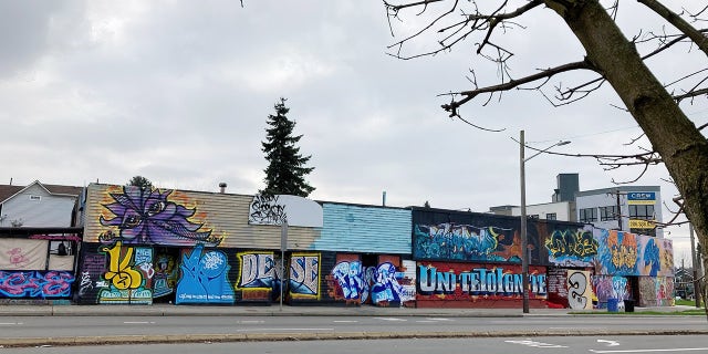 Virtually every inch of this row of buildings is covered in graffiti in Seattle, Washington, in Feb. 2022.