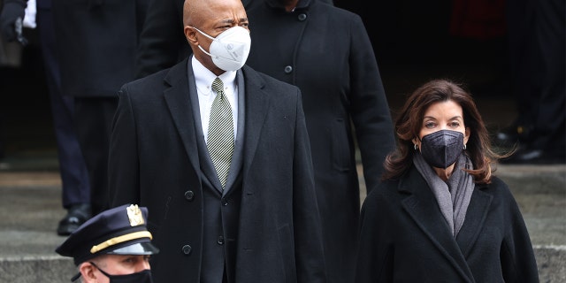 New York City Mayor Eric Adams and New York Gov. Kathy Hochul leave the funeral for fallen NYPD officer Wilbert Mora at St. Patrick's Cathedral on Feb. 2, 2022, in New York City.