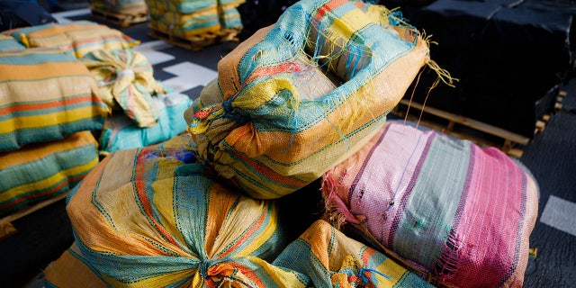 Packages of marijuana and cocaine during an offload at Port Everglades, in Fort Lauderdale, Fla., on Nov. 22, 2021. The U.S. Coast Guard offloaded millions of dollars of drugs intercepted at sea at Port Everglades.