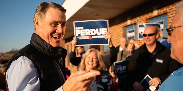 Former U.S. senator and Republican gubernatorial candidate David Perdue greets supporters at a campaign event on Feb. 1, 2022, in Dalton, Georgia. 