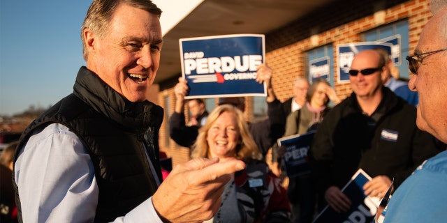 David Perdue, a former U.S. senator and Republican gubernatorial candidate, greets supporters at a campaign event Feb. 1, 2022, in Dalton, Ga.