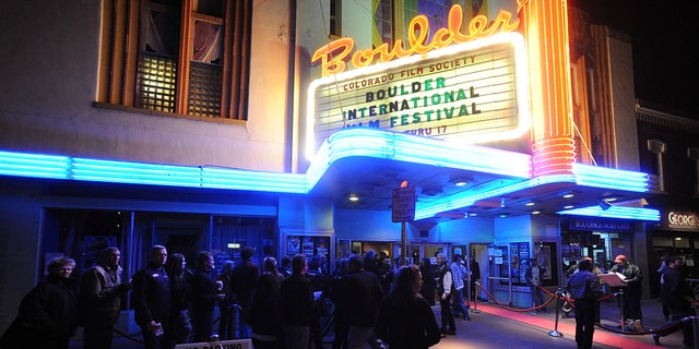 People wait to enter the Boulder Theater in Colorado in 2013.