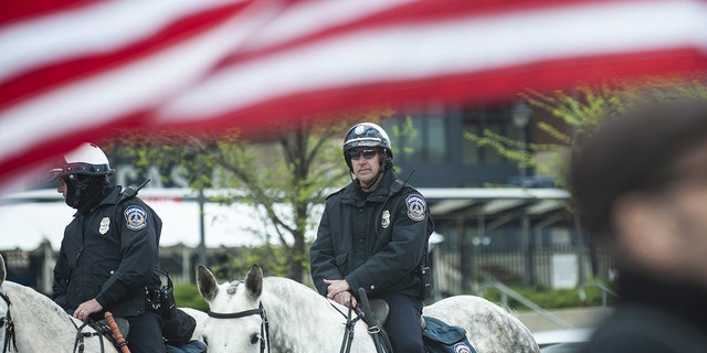Police officers on horseback guard a protest outside the National Rifle Association Institute for Legislative Action (NRA-ILA) Leadership Forum in Indianapolis, Indiana, U.S., on Friday, April 26, 2019.  Photographer: Matthew Hatcher/Bloomberg via Getty Images