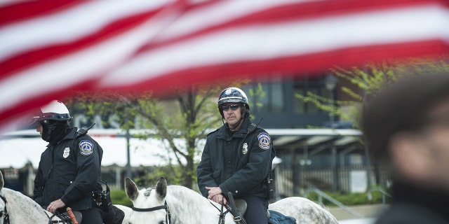 Police officers on horseback guard a protest outside the National Rifle Association Institute for Legislative Action (NRA-ILA) Leadership Forum in Indianapolis, Indiana, U.S., on Friday, April 26, 2019.  Photographer: Matthew Hatcher/Bloomberg via Getty Images