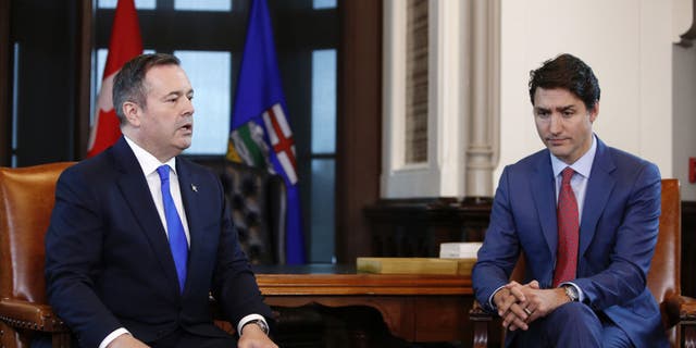 Alberta Premier Jason Kenney speaks while Canadian Prime Minister Justin Trudeau listens on Parliament Hill in Ottawa, Ontario, Canada, on Thursday, May 2, 2019.