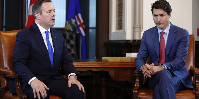 Canadian provinces begin backing off vaccine mandates amid lingering Freedom Convoy protests 3 Alberta Premier Jason Kenney speaks while Canadian Prime Minister Justin Trudeau listens on Parliament Hill in Ottawa, Ontario, Canada, on Thursday, May 2, 2019.