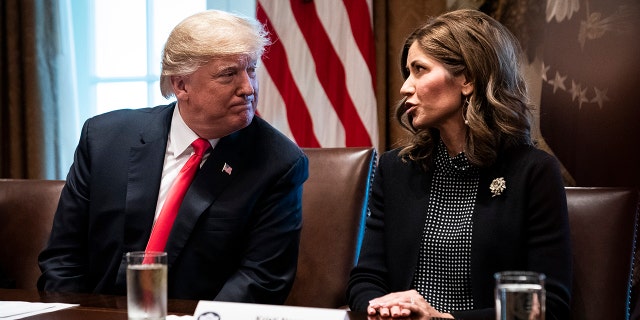 Then-President Trump speaks with then-South Dakota Gov.-elect Kristi Noem during a meeting at the White House, Dec. 13, 2018.