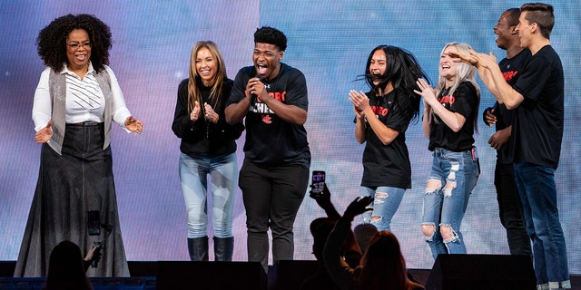 Oprah Winfrey speaks with the stars of Netflix's Cheers, , from second left: Monica Aldama, Jerry Harris, Gaby Butter, Lexi Brumback, TT Baker and Dillion Brandt at American Airlines Center on Feb. 15, 2020 in Dallas. (Getty Images)