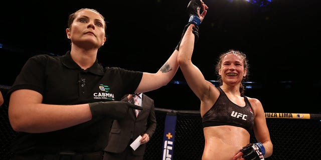 Ukrainian UFC Fighter Message for Putin: “F**K You, Bitch!” 2 Maryna Moroz of Ukraine celebrates after defeating Mayra Bueno Silva of Brazil in their flyweight fight during the UFC Fight Night event on March 14, 2020 in Brasilia, Brazil.