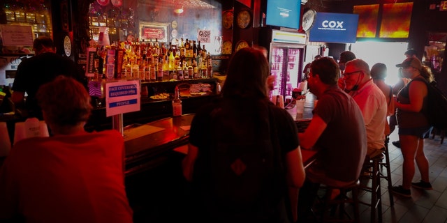 Residents gather at a bar during a power outage after Hurricane Ida in New Orleans, Louisiana, U.S., on Friday, Sept. 3, 2021. (Eva Marie Uzcategui/Bloomberg)