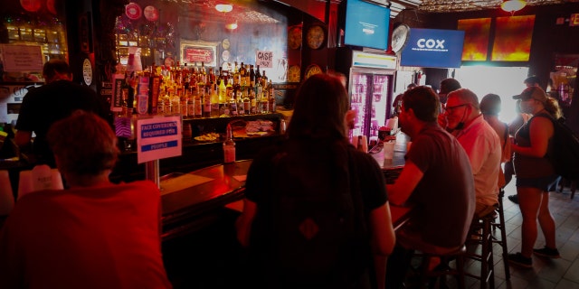 Residents gather at a bar during a power outage after Hurricane Ida in New Orleans, Louisiana, U.S., on Friday, Sept. 3, 2021. (Eva Marie Uzcategui/Bloomberg)