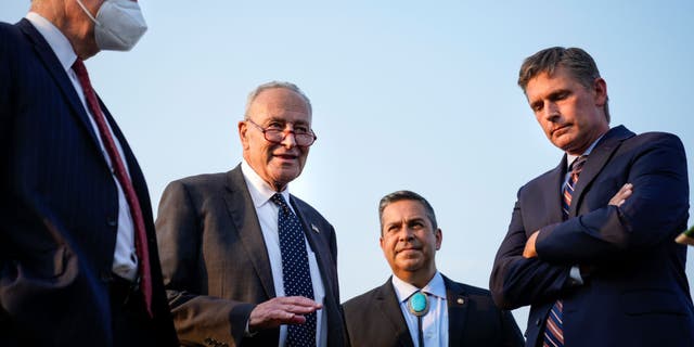 Sen. Sheldon Whitehouse (D-RI), Senate Majority Leader Chuck Schumer (D-NY), Sen. Ben Ray Lujan (D-NM) and Sen. Martin Heinrich (D-NM) wait to speak during a rally about climate change issues near the U.S. Capitol on Sept. 13, 2021, in Washington, D.C. (Photo by Drew Angerer/Getty Images)