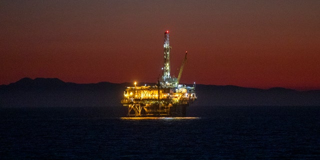 A view of oil platform Emmy off the coast of Huntington Beach at dusk Thursday, October 14, 2021. (Allen J. Schaben / Los Angeles Times via Getty Images)