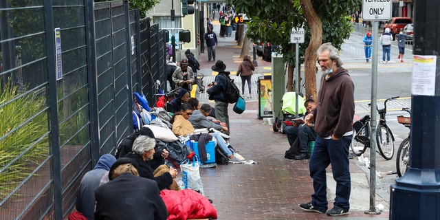 Homeless people are seen on streets of the Tenderloin district in San Francisco, California, Oct. 30, 2021.