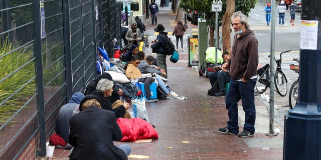 Homeless people are seen on streets of the Tenderloin district in San Francisco, California, United States on October 30, 2021.