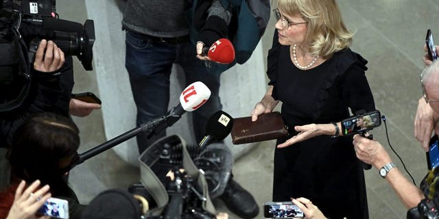 MP of the Finland's Christian Democrats Paivi Rasanen holds a Bible as she speaks to media ahead of a court session at the Helsinki District Court in Helsinki, Finland on Jan. 24, 2022. (ANTTI AIMO-KOIVISTO/Lehtikuva/AFP via Getty Images)