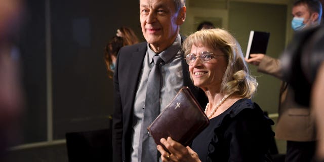 MP of the Finland's Christian Democrats Paivi Rasanen holds a Bible as she arrives with her husband Niilo Rasanen to attend a court session at the Helsinki District Court in Helsinki, Finland, on Jan. 24, 2022. (ANTTI AIMO-KOIVISTO/Lehtikuva/AFP via Getty Images)
