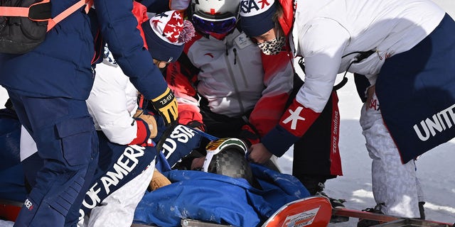 USA's Nina O'Brien receives medical assistance after a bad fall in the second run of the women's giant slalom during the Beijing 2022 Winter Olympic Games at the Yanqing National Alpine Skiing Centre in Yanqing on Feb. 7, 2022. 