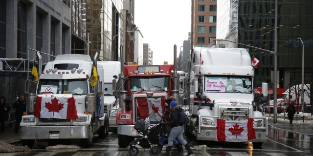 Trucks block a section of Metcalfe Street during a "Freedom Convoy" demonstration in downtown Ottawa, Canada, on Feb. 10, 2022.