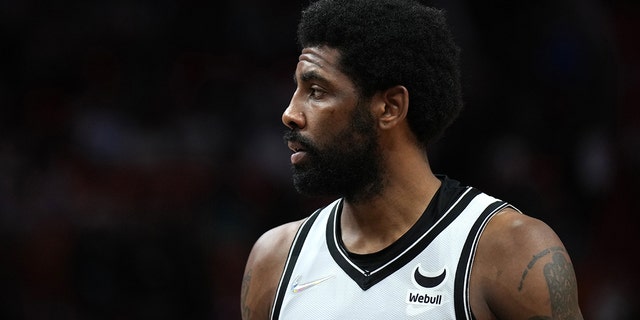Kyrie Irving #11 of the Brooklyn Nets looks on during the game against the Miami Heat on Feb. 12, 2022 at FTX Arena in Miami, Florida. 
