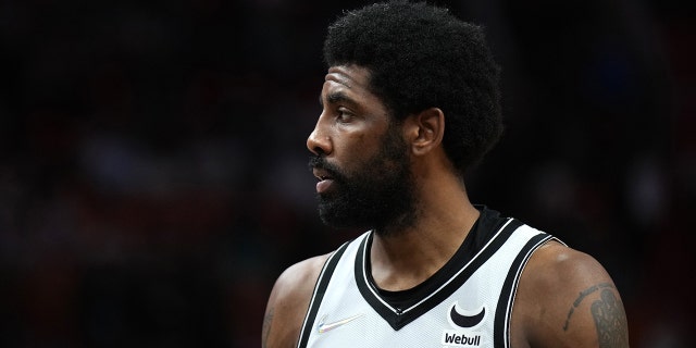 Kyrie Irving #11 of the Brooklyn Nets looks on during the game against the Miami Heat on Feb. 12, 2022 at FTX Arena in Miami, Florida. 