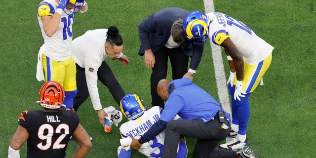 Los Angeles Rams wide receiver Odell Beckham Jr. is looked after by team trainers during the Super Bowl at SoFi Stadium on Feb. 13, 2022.