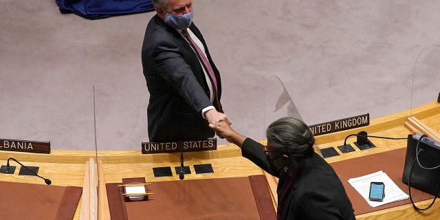 Permanent Representative of Ukraine to the United Nations (UN) Sergiy Kyslytsya (L) fist bumps US ambassador to the UN Linda Thomas-Greenfield (R) after he speaking during an emergency meeting of the UN Security Council on the Ukraine crisis, in New York, February 21, 2022. (Photo by TIMOTHY A. CLARY/AFP via Getty Images)