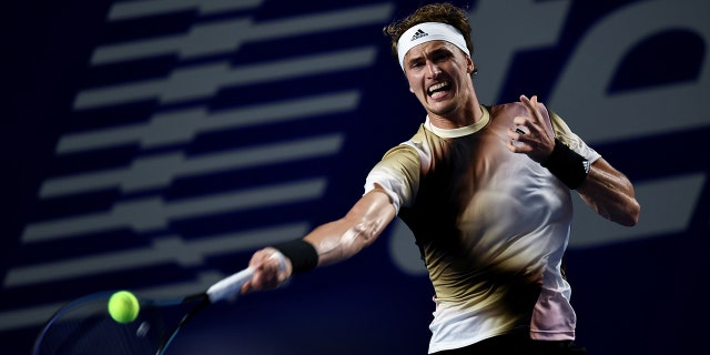 Alexander Zverev of Germany hits a return during men's singles first round match against Jenson Brooksby of the United States at the 2022 ATP Mexican Open tennis tournament in Acapulco, Mexico, Feb. 22, 2022.