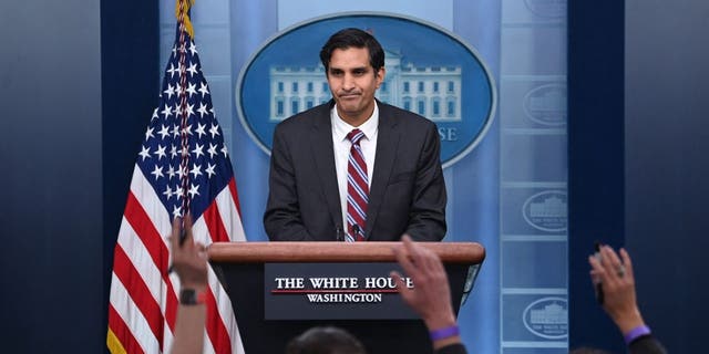 Reporters raise their hands to ask questions as Deputy National Security Advisor Daleep Singh speaks during a press briefing in the Brady Briefing Room of the White House in Washington, DC on February 24, 2022.