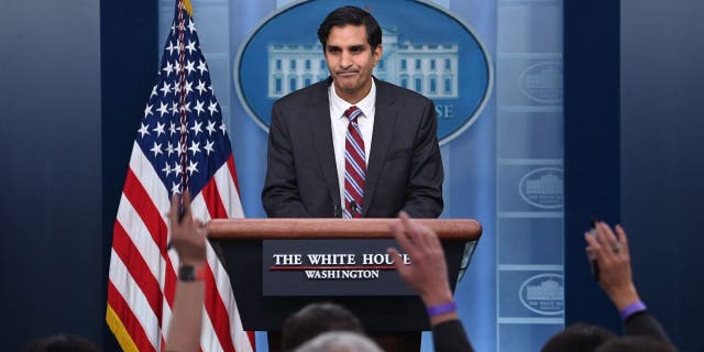 Reporters raise their hands to ask questions as Deputy National Security Advisor Daleep Singh speaks during a press briefing in the Brady Briefing Room of the White House in Washington, DC on February 24, 2022.