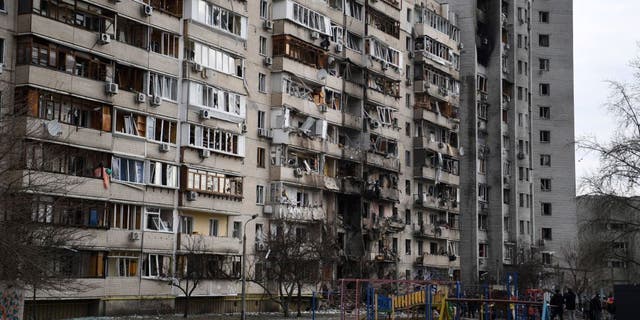 A damaged residential building on Koshytsa Street, a suburb of the Ukrainian capital Kyiv, where a military shell allegedly hit, on Feb. 25, 2022. (Daniel Leal/AFP via Getty Images)
