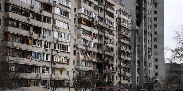 A damaged residential building on Koshytsa Street, a suburb of the Ukrainian capital Kyiv, where a military shell allegedly hit, on Feb. 25, 2022. (Daniel Leal/AFP via Getty Images)