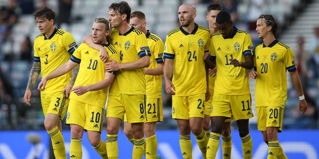 Emil Forsberg of Sweden (second from left) celebrates scoring a goal with his teammates during the UEFA Euro 2020 Championship Round of 16 match between Sweden and Ukraine at Hampden Park June 29, 2021, in Glasgow, Scotland. 