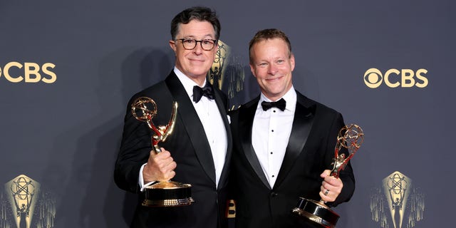 LOS ANGELES, CALIFORNIA - SEPTEMBER 19: (L-R) Stephen Colbert and Chris Licht, winners of the Outstanding Variety Special (Live) award on September 19, 2021 in Los Angeles, California. (Photo by Rich Fury/Getty Images)
