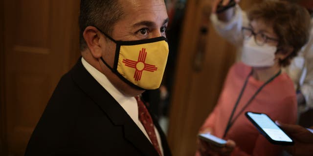 Sen. Ben Ray Luján, D-N.M., speaks to reporters as he arrives to the Senate for a series of votes in the U.S. Capitol on Oct. 6, 2021, in Washington, D.C. (Photo by Anna Moneymaker/Getty Images)
