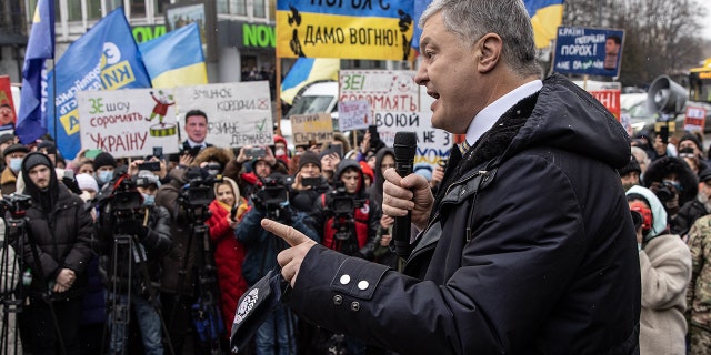 Ukraine's former President Petro Poroshenko speaks to supporters and media outside the Kyiv District Court of Appeal on Jan. 28, 2022.